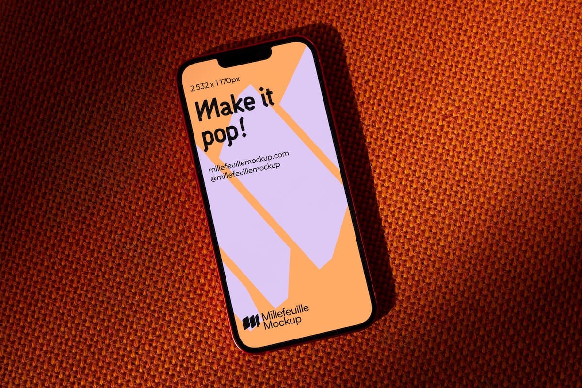 Beautiful iPhone mockup on an orange fabric texture from the 70s